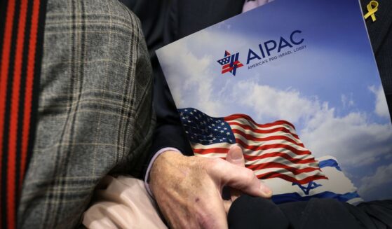 A visitor holds an AIPAC folder in an elevator on Capitol Hill in Washington, D.C. in a file photo from 2024.