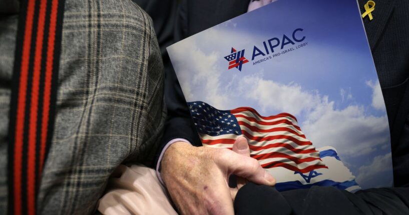A visitor holds an AIPAC folder in an elevator on Capitol Hill in Washington, D.C. in a file photo from 2024.