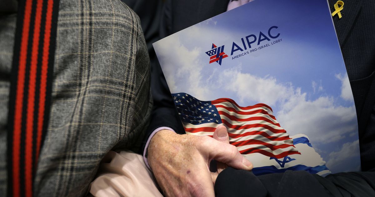 A visitor holds an AIPAC folder in an elevator on Capitol Hill in Washington, D.C. in a file photo from 2024.