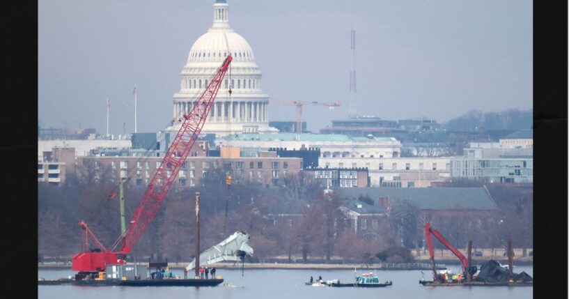 A crane lifts a piece of American Airlines flight 5342 from the Potomac River during recovery efforts on Feb. 3, 2025, in Arlington, Virginia. An American Airlines flight from Wichita, Kansas collided midair with a military Black Hawk helicopter while on approach to Ronald Reagan Washington National Airport outside of Washington, D.C., on Jan. 29, 2025 .