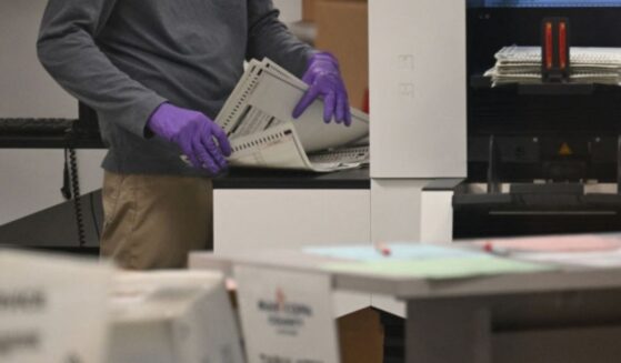 An election worker counts ballots inside the Maricopa County Tabulation and Election Center in Phoenix, Arizona, in a file photo dated Nov. 6, 2024.