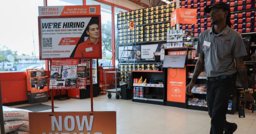 A "Now Hiring" sign is seen at an AutoZone on Feb. 11, 2026, in Hollywood, Florida.
