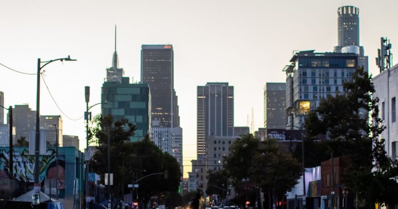 A homeless man walks on the street in Skid Row on July 25, 2025, in downtown Los Angeles, California.