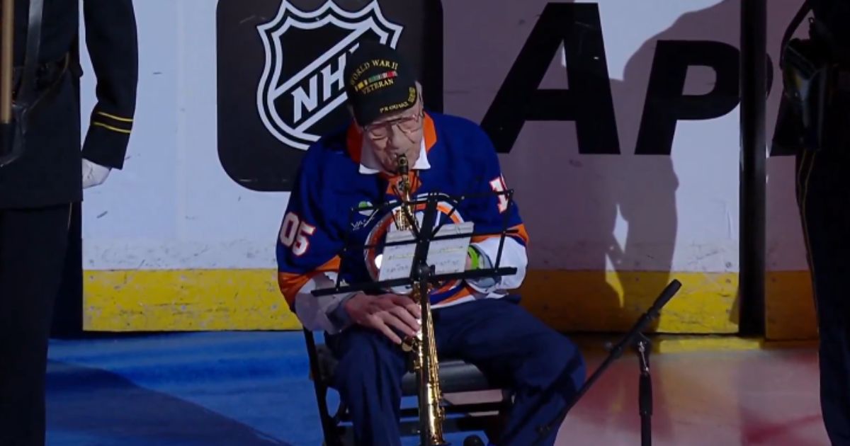 World War II veteran Dominick Critelli performs the National Anthem on the saxophone at the New York Islanders opener on Oct. 3, 2026.