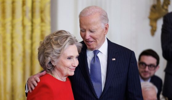 Former Secretary of State Hillary Clinton greets President Joe Biden before being awarded the Presidential Medal of Freedom in the East Room of the White House on Jan. 4, 2025, in Washington, D.C.