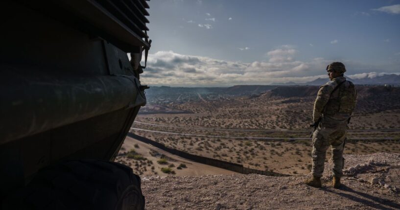 A U.S. Army soldier stands next to a Stryker armored infantry transport vehicle, which has been deployed along the Mexican border as part of the military's Joint Task Force Southern Border mission, in Sunland Park, New Mexico, on April 4, 2025.