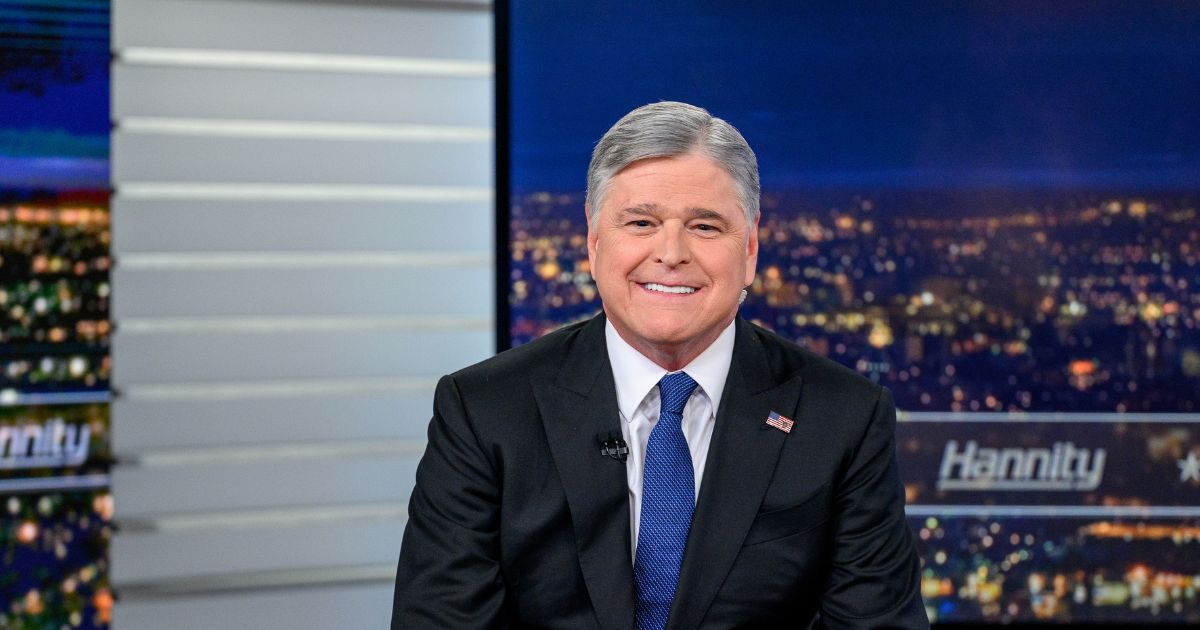 Host Sean Hannity poses as Vice President J.D. Vance visits the show "Hannity" at Fox News Channel Studios on June 15, 2026, in New York City.