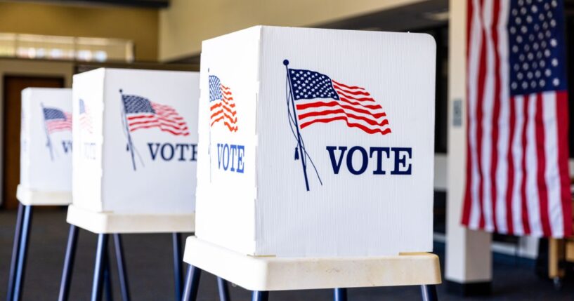 Voting booths set up in rows on election day.