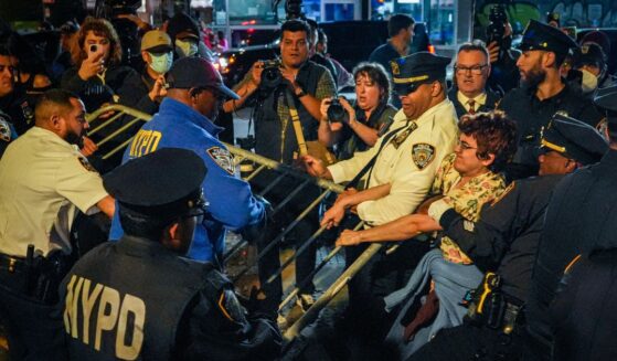 Protesters clash with NYPD officers after a man was shot by an Immigration and Customs Enforcement officer during an operation in the Bronx, on Oct. 8, 2026, in New York City.