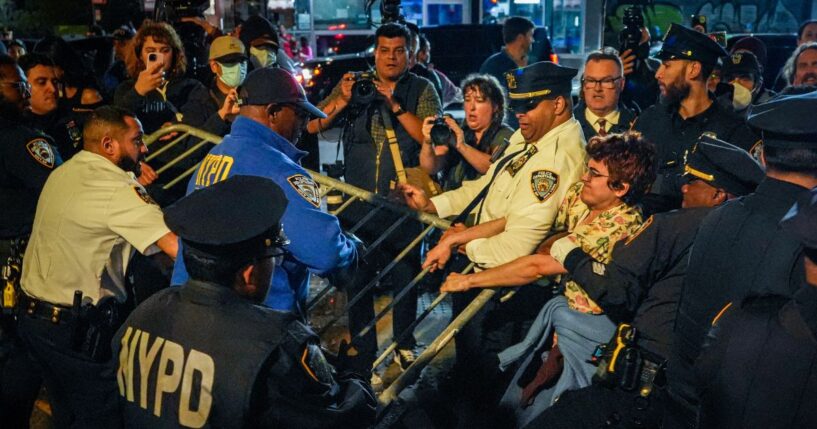 Protesters clash with NYPD officers after a man was shot by an Immigration and Customs Enforcement officer during an operation in the Bronx, on Oct. 8, 2026, in New York City.