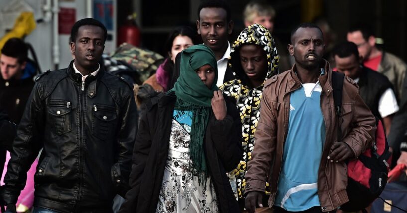 A group of migrants from Somalia that survived from an accident in the Aegean Sea last week arrive at the port of Piraeus in Athens on May 12, 2014.