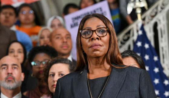 New York Attorney General Letitia James looks on as New York City Mayor Zohran Mamdani speaks during a news conference to announce a lawsuit challenging the federal government's new public charge rule, which could make it harder for immigrants to obtain green cards if they rely on public benefits, at City Hall in New York City on Sept. 14, 2026.