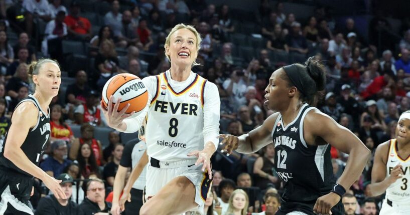 Sophie Cunningham of the Indiana Fever drives to the basket as she is fouled by Chelsea Gray of the Las Vegas Aces in the fourth quarter of Game One of the 2026 WNBA Playoffs first round at Michelob ULTRA Arena on Sept. 27, 2026, in Las Vegas, Nevada.