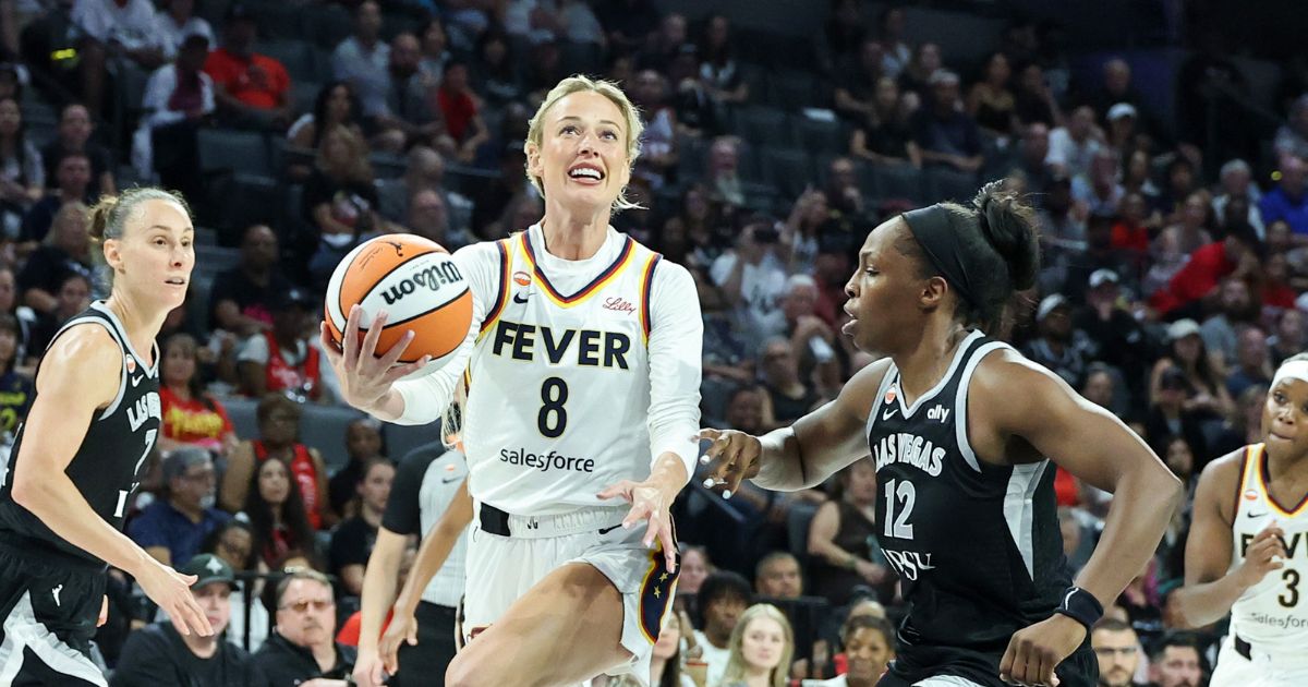 Sophie Cunningham of the Indiana Fever drives to the basket as she is fouled by Chelsea Gray of the Las Vegas Aces in the fourth quarter of Game One of the 2026 WNBA Playoffs first round at Michelob ULTRA Arena on Sept. 27, 2026, in Las Vegas, Nevada.