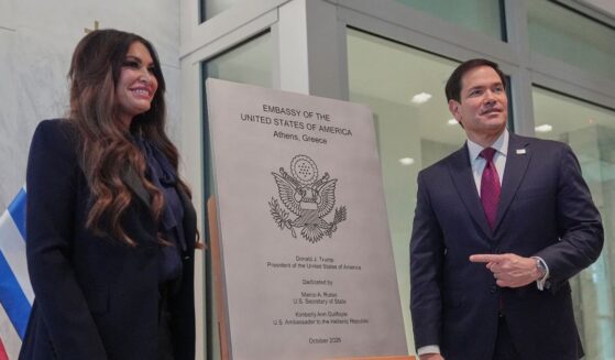 U.S. Ambassador to Greece Kimberly Guilfoyle and Secretary of State Marco Rubio unveil a plaque during a dedication ceremony at the chancery of the U.S. Embassy upon his arrival at the Greek foreign ministry in Athens, on Oct. 7, 2026.