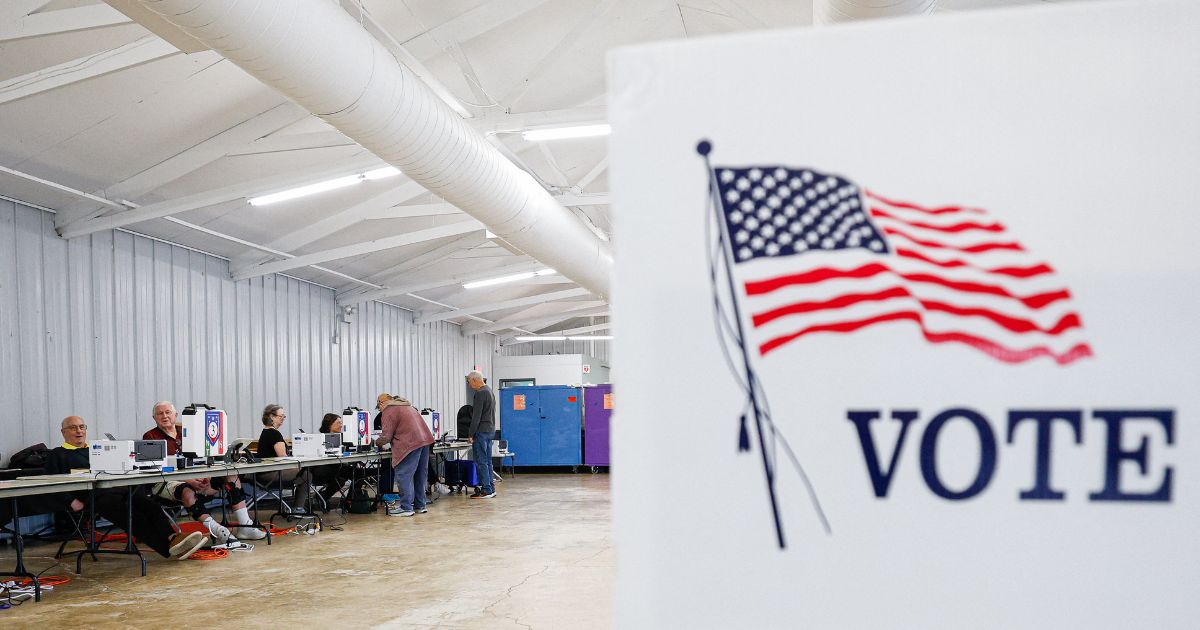 Voters check in on the second day of early voting ahead of the midterm elections, at a polling place at DuPage Event Center and Fairgrounds in Wheaton, Illinois, on Sept. 25, 2026.