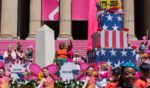 President General of Daughters of the American Revolution Ginnie Sebastian Storage and Anastacia McCleskey are seen on Artwork Float during the 2026 National Cherry Blossom Festival Parade on April 11, 2026, in Washington, D.C.
