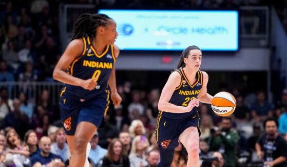 Caitlin Clark and Kelsey Mitchell of the Indiana Fever bring the ball up the floor against the Toronto Tempo during the first half in their WNBA game at Coca-Cola Coliseum on Sept. 18, 2026, in Toronto, Canada.