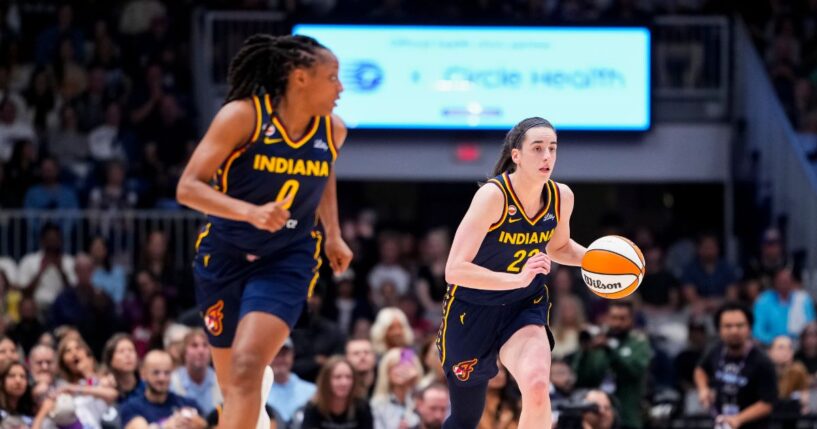Caitlin Clark and Kelsey Mitchell of the Indiana Fever bring the ball up the floor against the Toronto Tempo during the first half in their WNBA game at Coca-Cola Coliseum on Sept. 18, 2026, in Toronto, Canada.