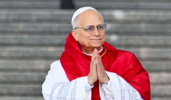 Pope Leo XIV gestures during a visit at the Maqam Echahid Martyrs' Monument in El Madania, near Algiers, on April 13, 2026.