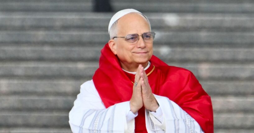 Pope Leo XIV gestures during a visit at the Maqam Echahid Martyrs' Monument in El Madania, near Algiers, on April 13, 2026.