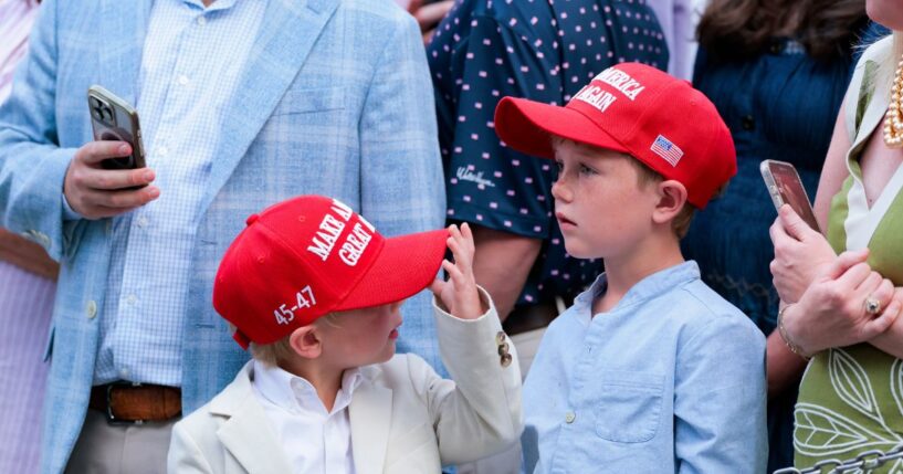 Guests donning Make America Great Again hats wait to greet President Donald Trump at the congressional picnic on the South Lawn of the White House on May 19, 2026, in Washington, D.C.