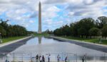 Visitors walk past the reflecting pool as it is refilled on Monday, Oct. 12, 2026.