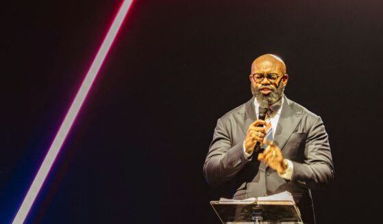 Pastor John Amanchukwu leads the daily prayer at Turning Point's AmericaFest conference, in remembrance of late right-wing political activist Charlie Kirk, in Phoenix, Arizona, on Dec. 18, 2025.