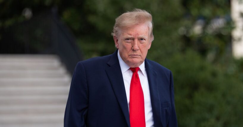 President Donald Trump walks on the South Lawn as he departs the White House on Oct. 12, 2026, in Washington, D.C.