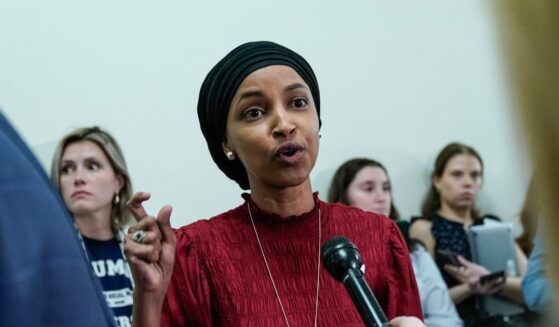 Rep. Ilhan Omar speaks to reporters in the hallway outside a House Committee on Education and the Workforce hearing "Columbia in Crisis: Columbia University's Response to Anti-Semitism" at Capitol Hill in Washington, D.C., on April 17, 2024.