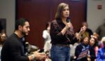 Democratic Senate candidate Abdul El-Sayed (L) reacts as Sen. Elissa Slotkin speaks during a town hall campaign event in Warren, Michigan, on Oct. 3, 2026.