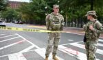 U.S. National Guard members stand by a police line after a car crashed into a barricade near the White House in Washington, D.C., on Sept. 19, 2026.