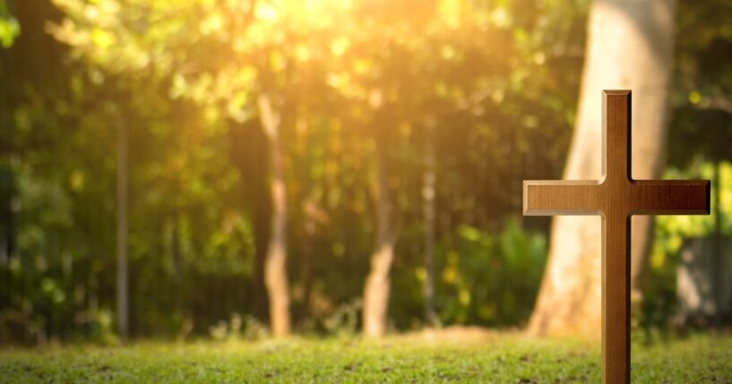 A cross in a yard.