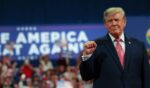 President Donald Trump greets supporters during a campaign rally at Heartland Credit Union Arena on Oct. 19, 2026, in Park City, Kansas.