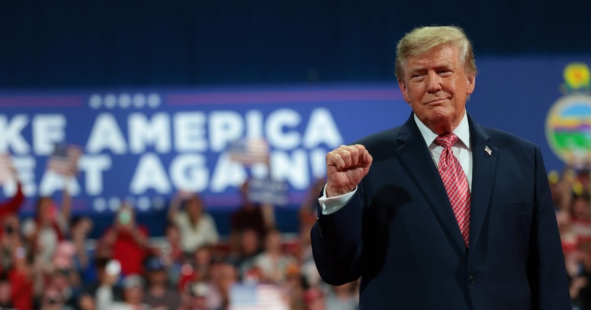 President Donald Trump greets supporters during a campaign rally at Heartland Credit Union Arena on Oct. 19, 2026, in Park City, Kansas.