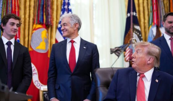 President Donald Trump acknowledges conservative influencer Nick Shirley as Administrator for the Centers for Medicare & Medicaid Services Dr. Mehmet Oz and Vice President J.D. Vance look on during an event in the Oval Office of the White House on Oct. 20, 2026, in Washington, D.C.