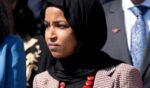 Rep. Ilhan Omar wears an anti-assault rifle pin during a news conference on gun violence, outside the U.S. Capitol in Washington, D.C., on March 29, 2023.