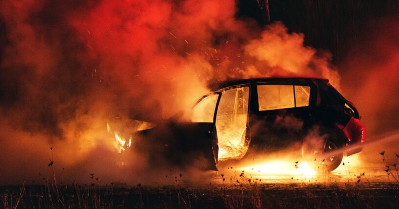 Firefighters extinguish a car fire on Nova Scotia's Highway 102.