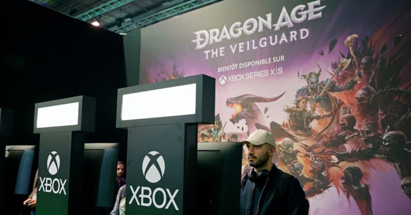 A gamer plays a video game developed by BioWare and published by Electronic Arts on the Xbox console during the 