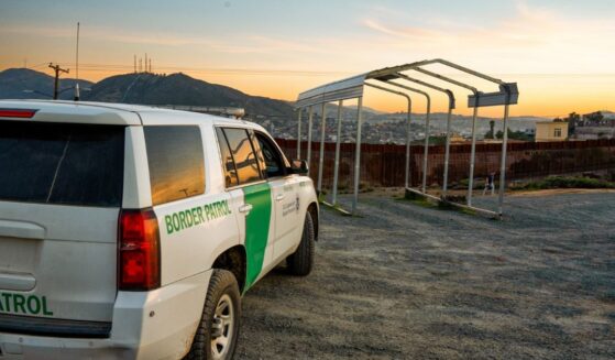 U.S. Border Patrol vehicle parked near the border wall in Tecate, California.