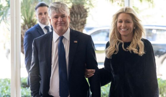 Fox News host Sean Hannity and his fiancee, Fox News host Ainsley Earhardt, arrive to attend the wedding of Dan Scavino, White House Deputy Chief of Staff, and Erin Elmore, the Department of State Director of Art in Embassies, at Mar-a-Lago in Palm Beach, Florida, on Feb. 1, 2026.