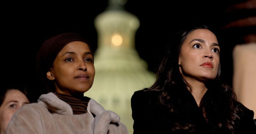 Rep. Ilhan Omar and Rep. Alexandria Ocasio-Cortez listen during a news conference calling for a ceasefire in Gaza outside the U.S. Capitol building on Nov. 13, 2023, in Washington, D.C.