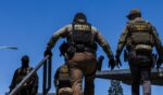 Immigration and Customs Enforcement agents walk outside the Ventura County Government Center in Ventura, California, on July 27, 2026.