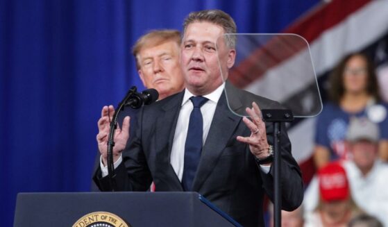 Audi AG CEO Gernot Dollner speaks alongside President Donald Trump during a midterm campaign rally at the Guardian Centers on Oct. 24, 2026, in Perry, Georgia.