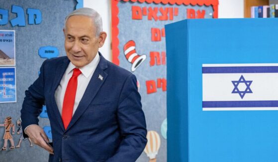 Israeli Prime Minister Benjamin Netanyahu reacts after filling out his ballot before voting at a polling station in Jerusalem on Oct. 27, 2026, on the day of Israel's legislative election.
