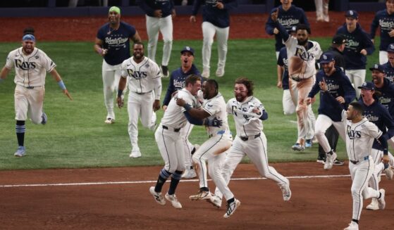 The Tampa Bay Rays celebrate with Ben Williamson after hitting an RBI Single during the twelfth inning to defeat the Milwaukee Brewers in game four of the 2026 World Series at Tropicana Field on Oct. 27, 2026, in St. Petersburg, Florida.