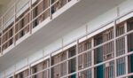 Rows of prison cells.