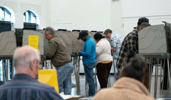 People fill their ballots in early voting for the midterm elections on Oct. 25, 2026, in Cary, North Carolina.