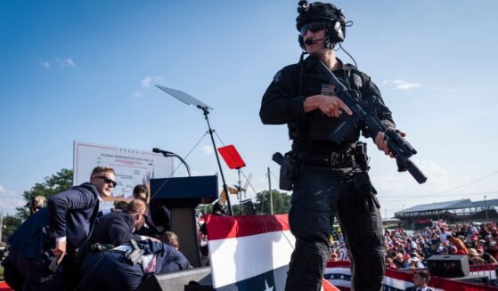U.S. Secret Service agents and counter assault team react moments after shots were fired toward President Donald Trump during a campaign rally at Butler Farm Show Inc. in Butler, Pennsylvania, on Saturday, July 13, 2024.