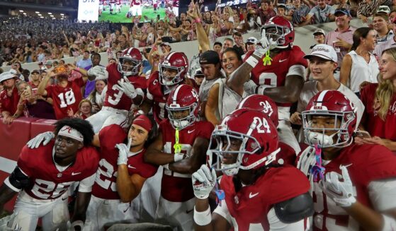 Alabama Crimson Tide players pose with fans after beating the Florida State Seminoles 50-36 at Bryant-Denny Stadium on Sept. 19, 2026 in Tuscaloosa, Alabama. Alabama is scheduled to host the Georgia Bulldogs Saturday at 7:30 p.m. in Tuscaloosa.